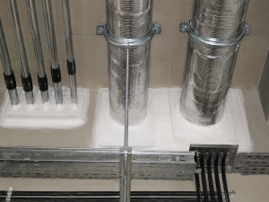 Services combined pipe and cable fire stopping