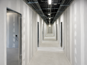 Services tape & jointing to corridor walls